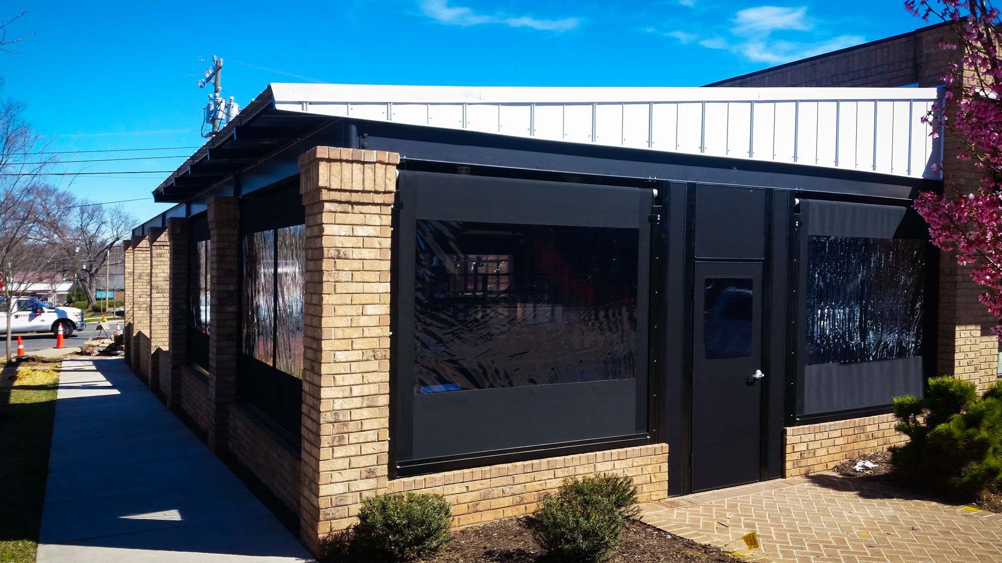 Screen room and seasonal enclosure with patio curtains